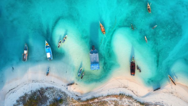 20065 Aerialviewfishingboatsclearazurewatersunsetsummer Orig